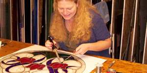 Student making stained glass window